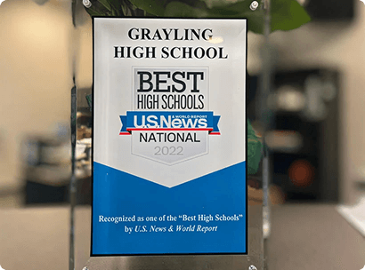 Glass tabletop trophy for Grayling High School with a “Best High Schools National” U.S. News badge and text reading “Recognized as one of the “Best High Schools” by U.S. News & World Report.